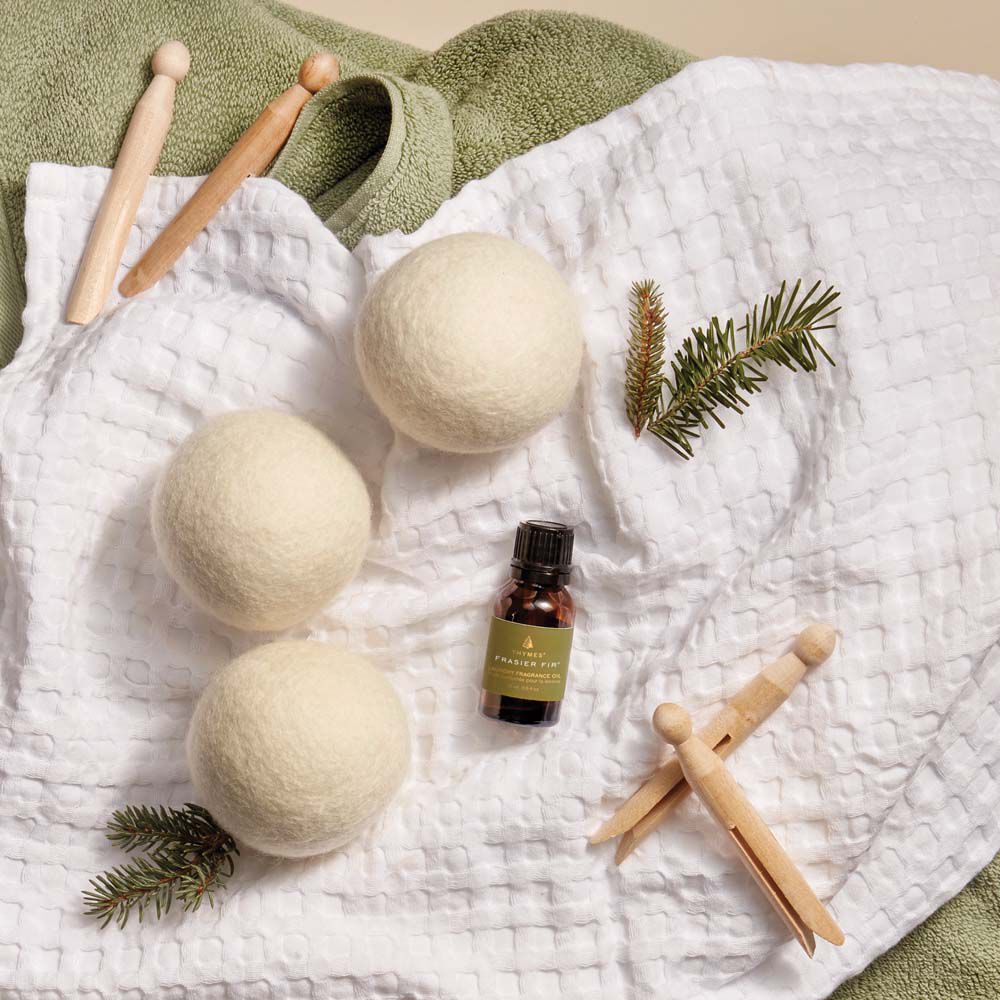 frasier-fir-wool-dryer-balls-and-oil-in-basket-holiday-2021-2000x2000-1.jpg